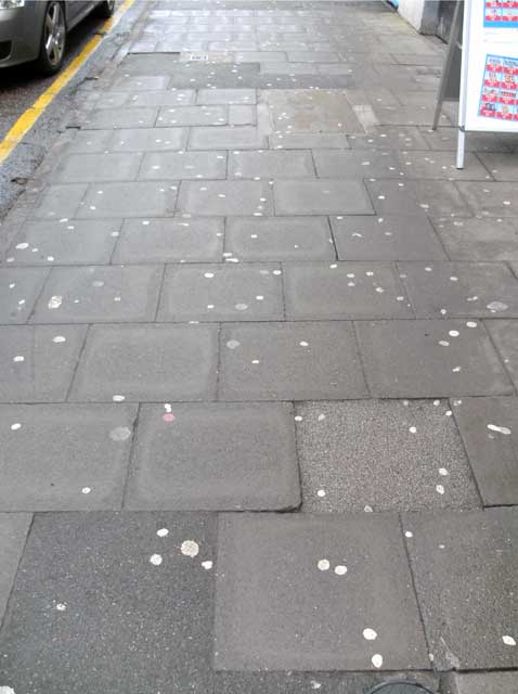 Chewing gum on the pavement making my town look like a shit-hole